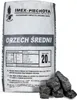 A bag of coal with some pieces of coal in front of it. Produktbild-Vorschau