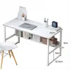 A white desk with shelves, a laptop, books, and decorative items, next to a chair. Podgląd zdjęcia produktu