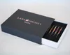 A dark gray box with a sliding drawer containing knitting needles. Produktbild-Vorschau