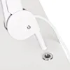 A close-up view of a white mechanical joint with a cable and a metal grommet on a white surface. Produktbild-Vorschau