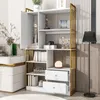 A white bookshelf with gold accents, featuring various decorative items and drawers, placed in a room setting. Podgląd zdjęcia produktu