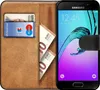 A book-style phone case with a Samsung phone inside, showing cards and banknotes. Produktbild-Vorschau