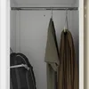 Inside of a locker or cabinet with clothes hanging and a backpack. Anteprima dell’immagine prodotto