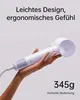 A hand holding a white and purple hairdryer against a light gray background. Produktbild-Vorschau