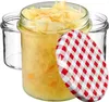 Three glass jars, one filled with sauerkraut, and a red and white checkered lid. Produktbild-Vorschau