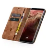 A brown leather flip case for a smartphone, with cards and a banknote inserted. Produktbild-Vorschau