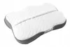 A white and gray orthopedic pillow with a contoured shape, shown from a slightly elevated angle against a white background. Náhled obrázku produktu