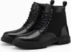 A pair of black leather boots on a white background. Produktbild-Vorschau