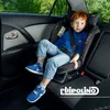 A child sits in a car seat in the back seat of a car. Produktbild-Vorschau