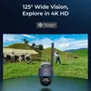 A security camera is shown in the foreground with a rural landscape in the background, featuring cows and a farmer. Produktbild-Vorschau