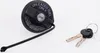 A black fuel tank cap with a tether and two keys on a white background. Produktbild-Vorschau