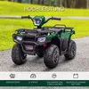 A green toy quad bike is parked on a gravel path with a blurred green background of trees and grass. Náhled obrázku produktu