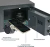 An open safe with a smartphone, watch, and keys inside, along with a camera lens in the background. Anteprima dell’immagine prodotto