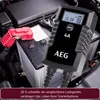 A car battery charger is shown connected to a car battery. Produktbild-Vorschau