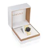 A gold Versace watch is displayed inside its white and brown branded box. Náhled obrázku produktu