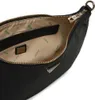 Close-up view of the interior of a black Guess hobo shoulder bag, showing the lining and a zipper pocket. Produktbild-Vorschau