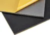 Three layers of foam material, one with a yellow backing peeled back, are shown against a white background. Anteprima dell’immagine prodotto