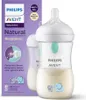 A Philips Avent baby bottle and its packaging are shown. The packaging has text and graphics describing the product's features. The bottle is filled with liquid and has a nipple and a cap. Produktbild-Vorschau