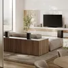 A modern living room with a large television, sofa, and several speakers. Produktbild-Vorschau