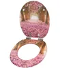 An open toilet seat and lid with a floral pattern. Náhled obrázku produktu