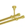 A close-up view of a double curtain rod system in a brass gold finish, mounted from the ceiling. Produktbild-Vorschau