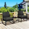 A balcony setting with a view of trees and houses, featuring a black rattan furniture set. Podgląd zdjęcia produktu