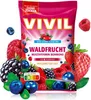 A product shot of VIVIL Waldfrucht Multivitaminbonbons, surrounded by various berries. Produktbild-Vorschau