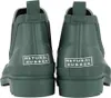 The back view of a pair of green rubber boots. Produktbild-Vorschau