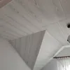 A view of a room's ceiling with decorative panels. Anteprima dell’immagine prodotto