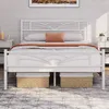 A white metal bed frame with a cloud pattern headboard is shown in a bedroom setting. Produktbild-Vorschau