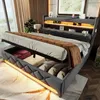 A modern bedroom with a bed featuring storage and LED lighting. Produktbild-Vorschau