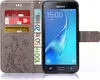 A grey flip case for a Samsung Galaxy J5 2016 phone, showing credit cards and euro banknotes inserted into the case. Produktbild-Vorschau