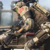 A soldier in futuristic armor crouches with a rifle, suggesting a video game or military simulation. Náhľad obrázku produktu