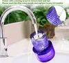 A vacuum cleaner filter is being rinsed under a faucet in a sink. Produktbild-Vorschau