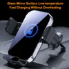 A close-up shot of a black wireless car charger with a glowing blue battery icon on its screen, placed on a textured gray surface. Produktbild-Vorschau