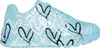 A side view of a turquoise sneaker with a heart pattern. Produktbild-Vorschau