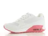 A side view of a white and pink sneaker against a white background. Produktbild-Vorschau