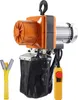A product shot of an electric chain hoist with a remote control and a lifting strap. Anteprima dell’immagine prodotto