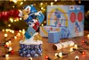A Sonic the Hedgehog figurine is displayed on a wooden surface, surrounded by Christmas lights and packaging. Podgląd zdjęcia produktu