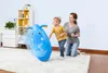 A woman and a child are playing with a blue inflatable elephant bop bag in a room. Produktbild-Vorschau