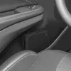 A black storage case is tucked into a compartment in a car's interior, next to the driver's seat and door panel. Produktbild-Vorschau