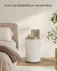 A bedroom scene with a bed and a side table. Produktbild-Vorschau