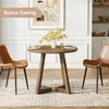 A round dining table with two chairs in a dining room setting. Anteprima dell’immagine prodotto
