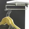 A pull-out clothes hanger attached to a shelf in a closet. Produktbild-Vorschau