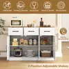 A white and brown buffet cabinet with items stored inside, set against a light-colored wall. Podgląd zdjęcia produktu