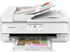 A white Canon PIXMA TS9551Ca printer is shown from the front, with documents in the input tray and output tray. Podgląd zdjęcia produktu