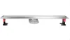 A linear shower drain with adjustable feet and a central drain outlet, presented against a white background. Náhľad obrázku produktu