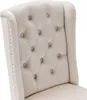 Close-up of the tufted back of a beige upholstered chair. Anteprima dell’immagine prodotto