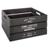 A black wooden crate with white text on its sides, shown from a slightly elevated angle against a white background. Podgląd zdjęcia produktu