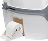 A close-up view of a portable toilet, showing the toilet paper holder and a roll of toilet paper. Voir les images du produit